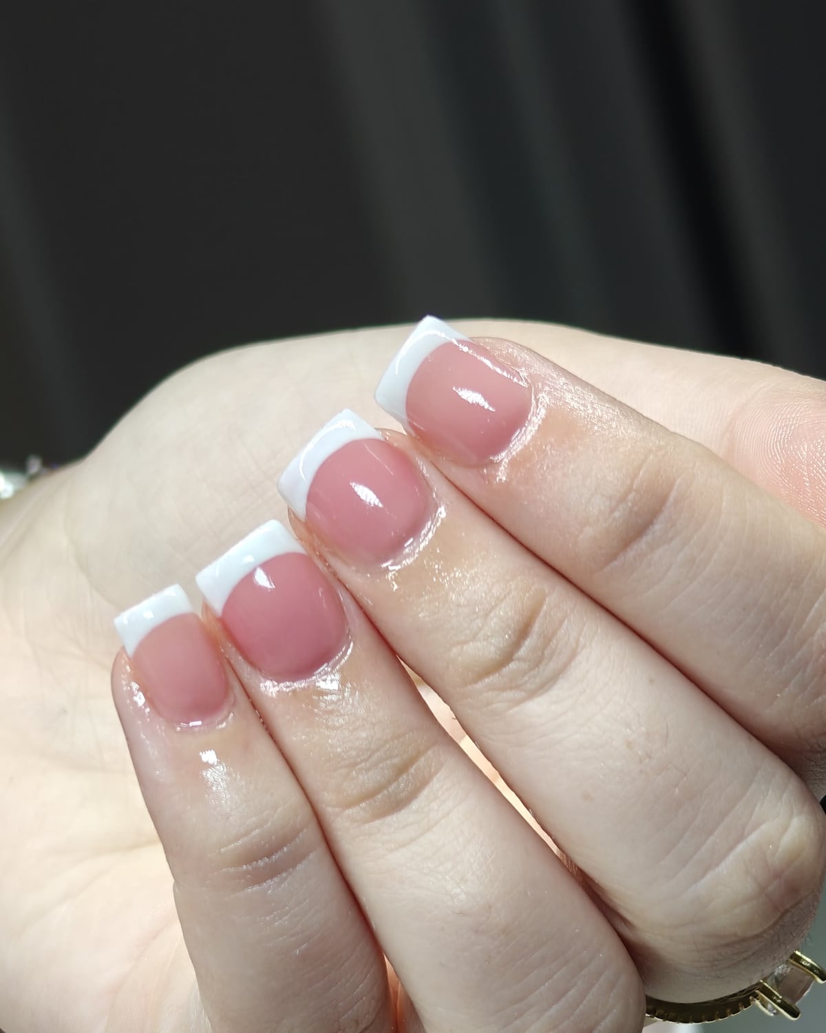 Nail work from Only Nails Beauty — a classic French manicure on short square nails with a rosy pink base and crisp white tips.